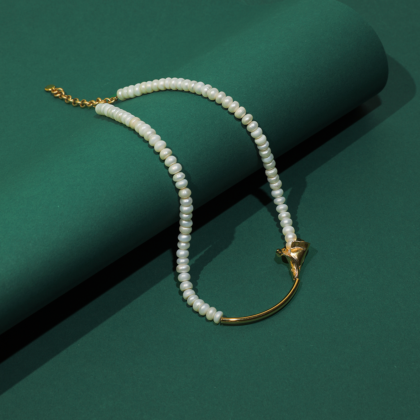 Pearl necklace with flower accent. Gold plated
