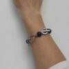 IMG_20241126_151039 Handmade bracelet with black marble beads, silver-plated brass details, and a toggle clasp