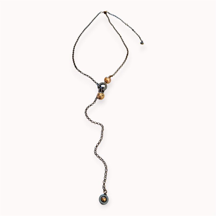 Brown and grey pendant with antique gold plated lava, hematite and Swarovski pearl